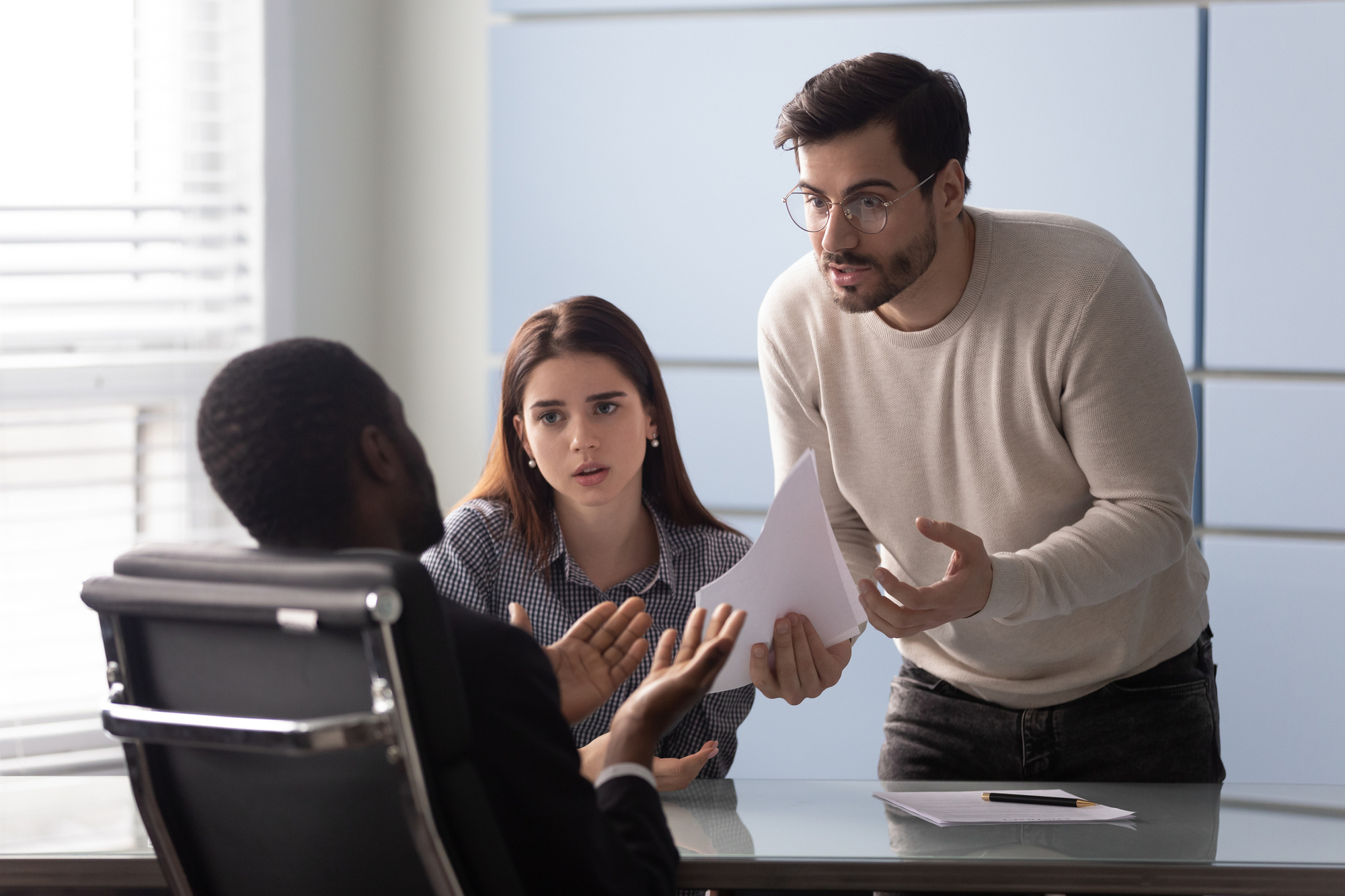upset couple talking to banker