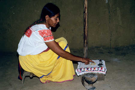 A Nahua ritual specialist reads the lie of corn kernels in an effort to divine the cause of a disease. Photo by Pamela Effrein Sandstrom and Allen Sandstrom (all rights reserved). A Nahua ritual specialist reads the lie of corn kernels in an effort to divine the cause of a disease. Photo by Pamela Effrein Sandstrom and Allen Sandstrom (all rights reserved).