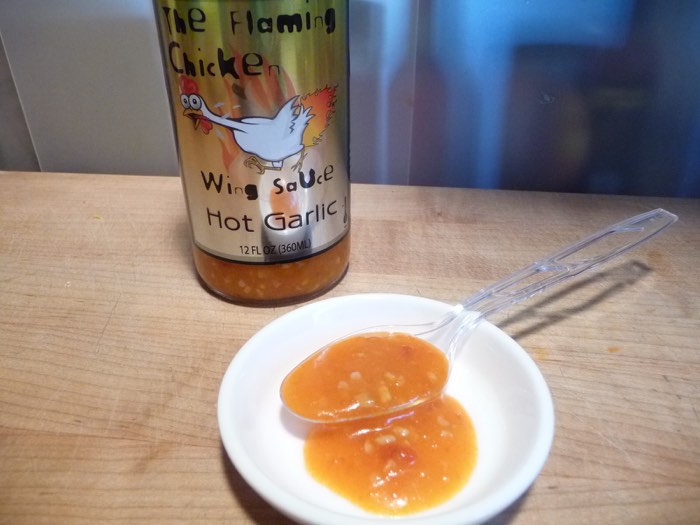 The Flaming Chicken Hot Garlic Wing Sauce is loaded with garlic