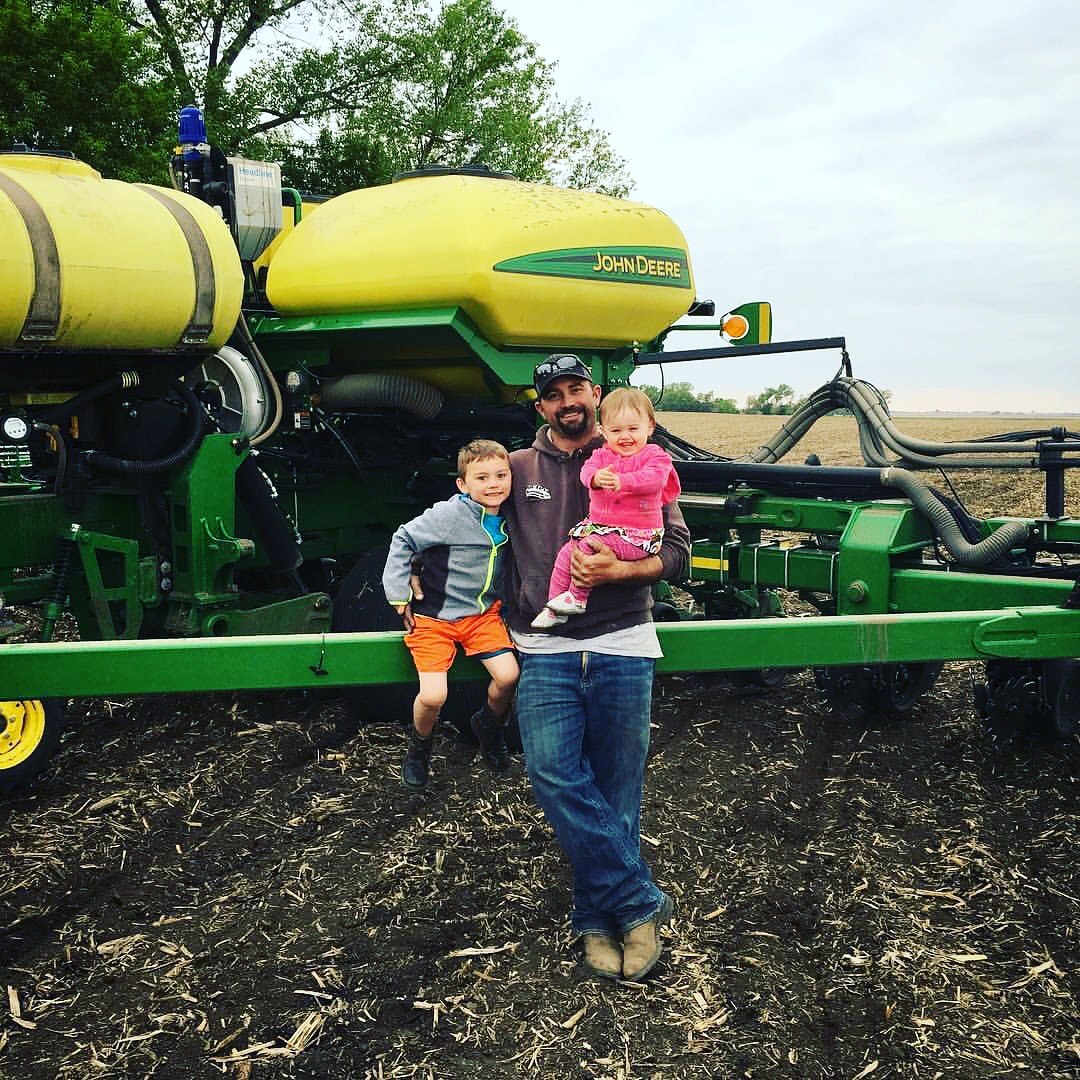John Horter with his kids on their South Dakota farm.