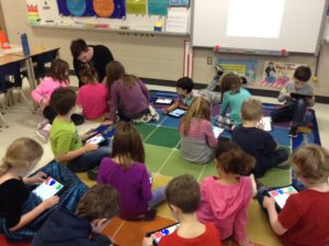 Teacher working in a classroom with students