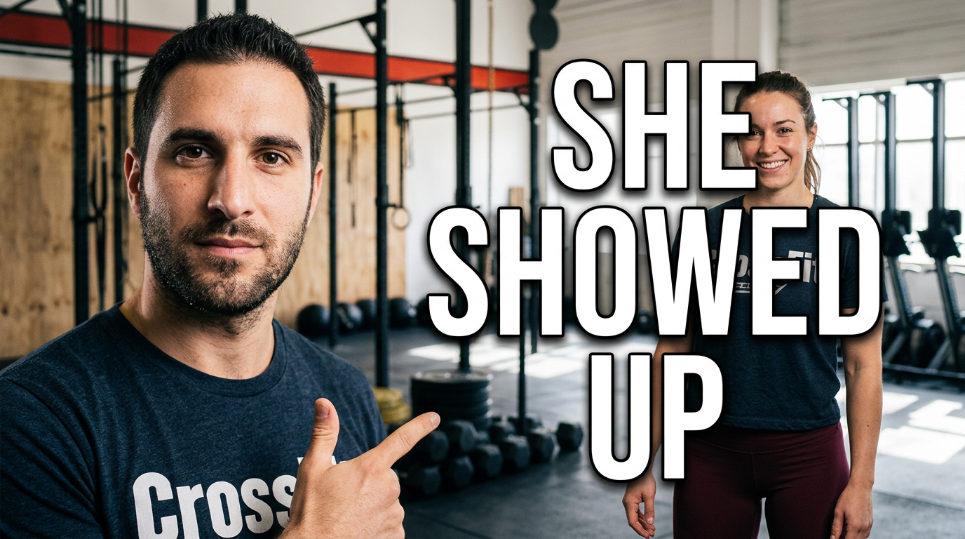 Female gym member portrait in a CrossFit facility with training equipment in the background