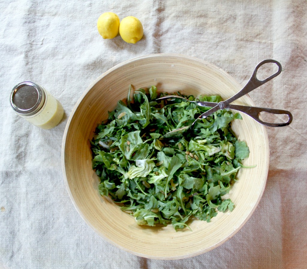 Green Salad with arugula and fresh herbs, topped with simple lemon vinaigrette!