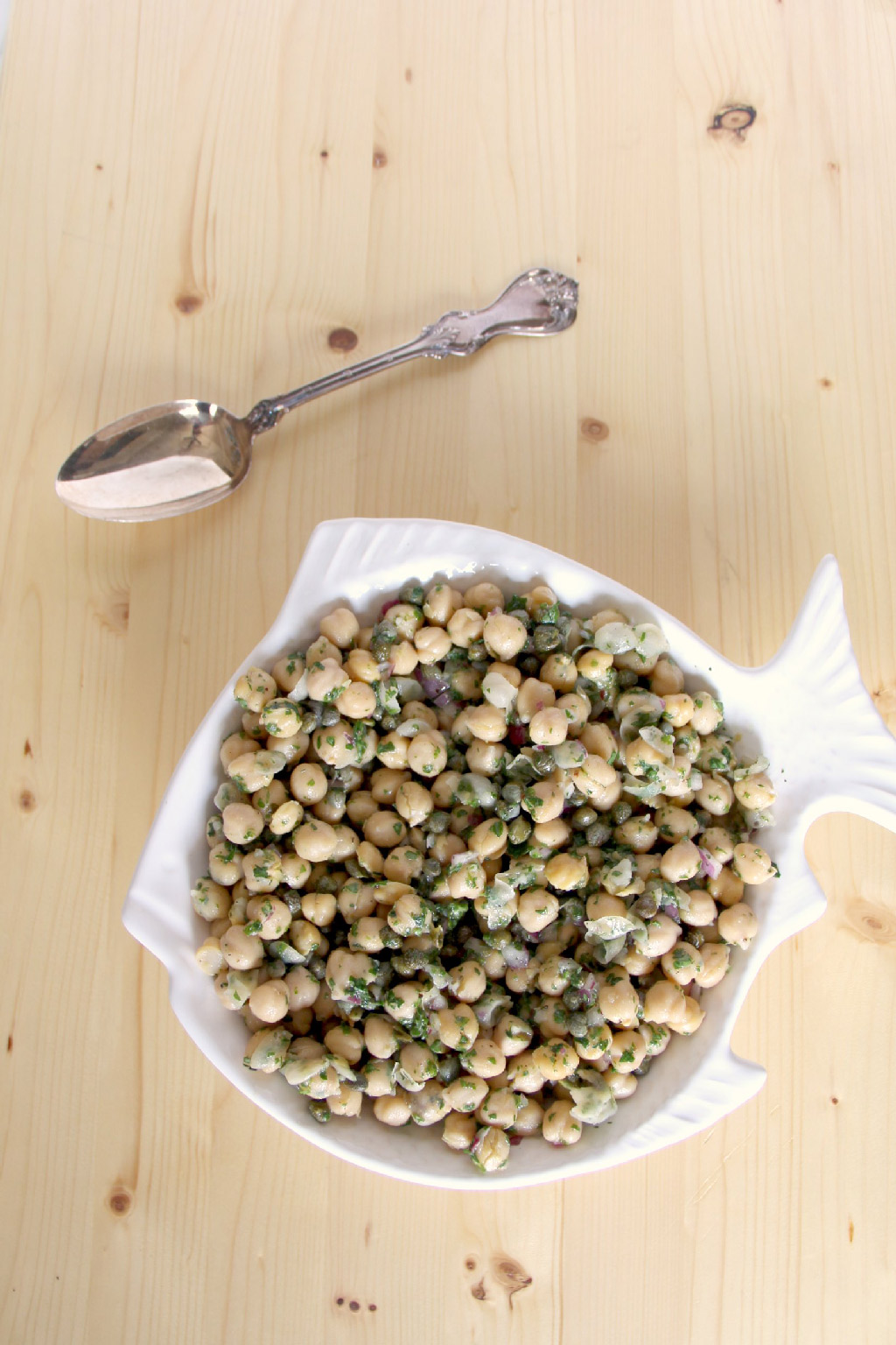 Chickpea salad that's super easy and healthy, with just chickpeas, parsley, onion, and capers, mixed with a lemon vinaigrette.