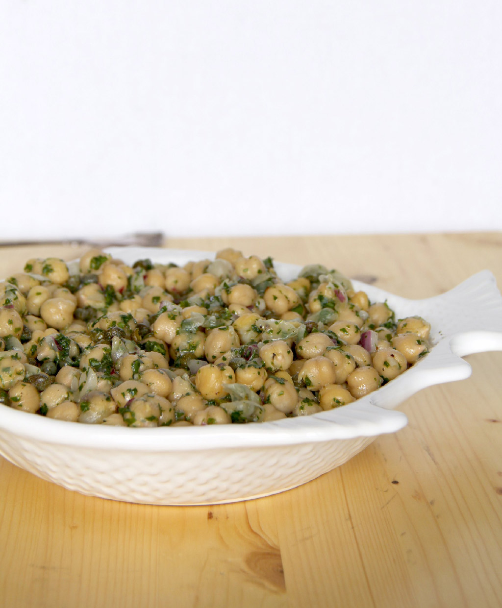 Chickpea salad that's super easy and healthy, with just chickpeas, parsley, onion, and capers, mixed with a lemon vinaigrette. 