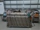 7 Racks of Green Folding Chairs.  Approximately 250 to -