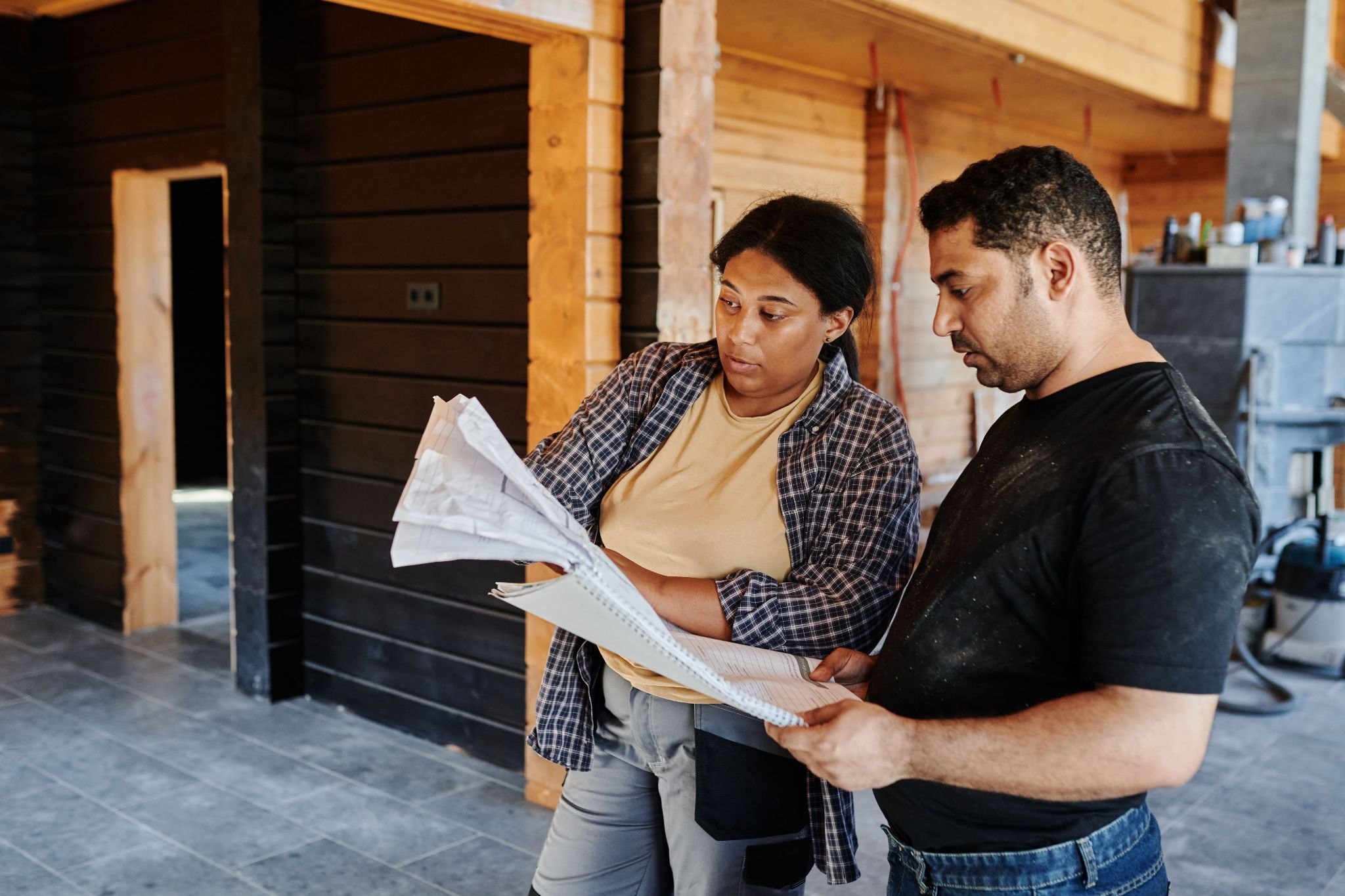 how kitchen cabinet distributors work blog with two contractors looking at schematics