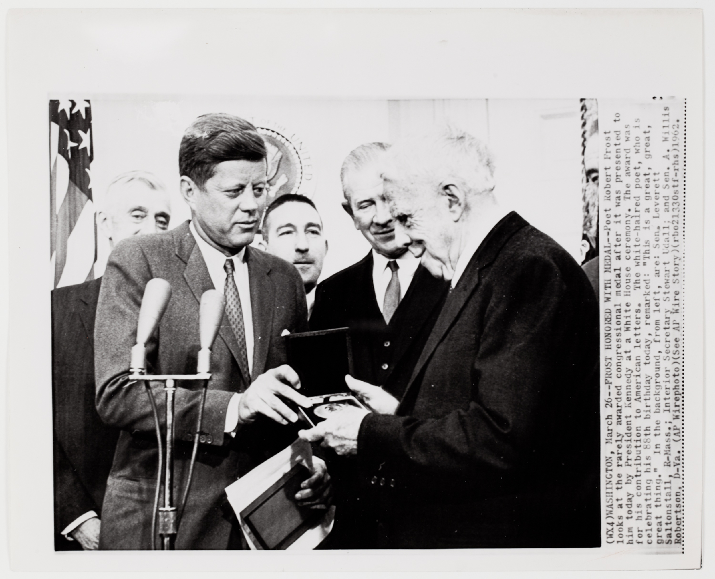 [President John F. Kennedy presenting American poet Robert Frost the Congressional medal