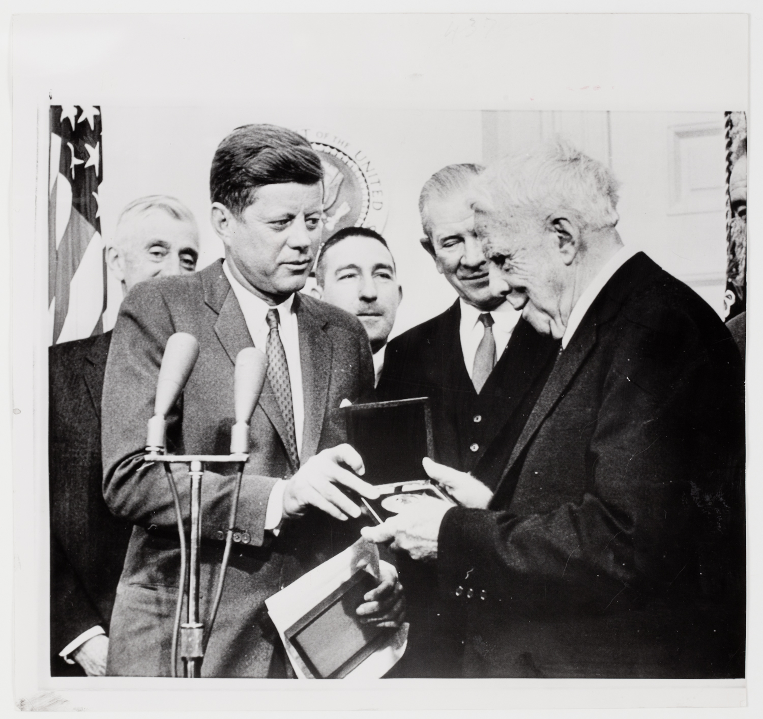 [President John F. Kennedy presenting American poet Robert Frost the