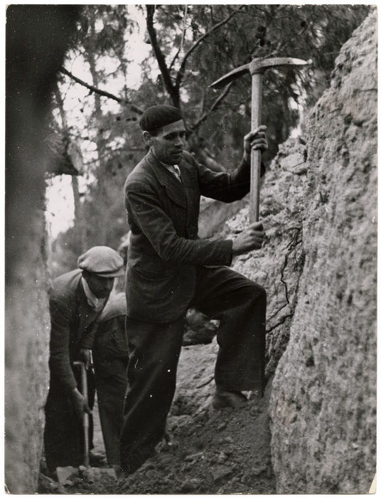 [Men in ditch with pickaxes, Mount Sollube, Spain]