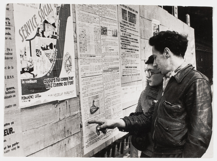 [Young couple reading posters for the women's suffrage, Paris]