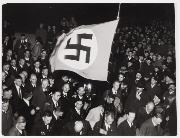 [Crowd with Nazi flag at the time of a peace rally, Verdun, France]