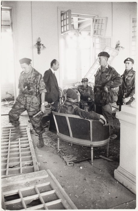 [Soldiers in bombed living room, Suez]