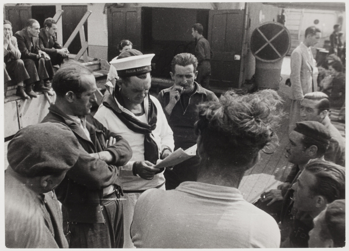 [Sailor and refugees aboard SS Sinaia]