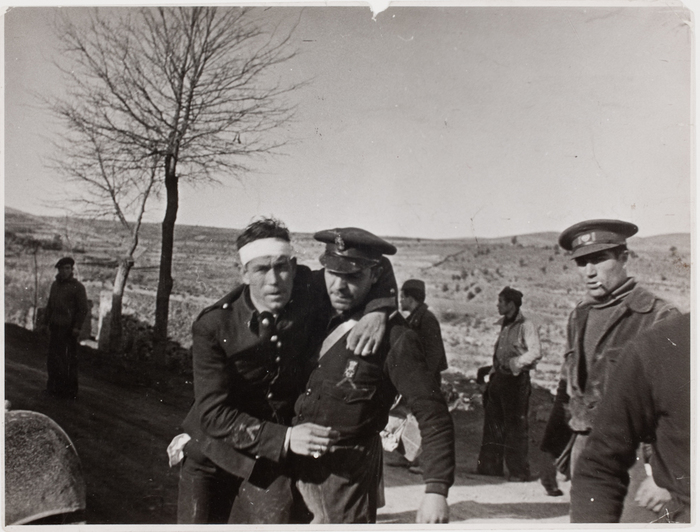 [Soldier assisting wounded soldier, Teruel, Spain]