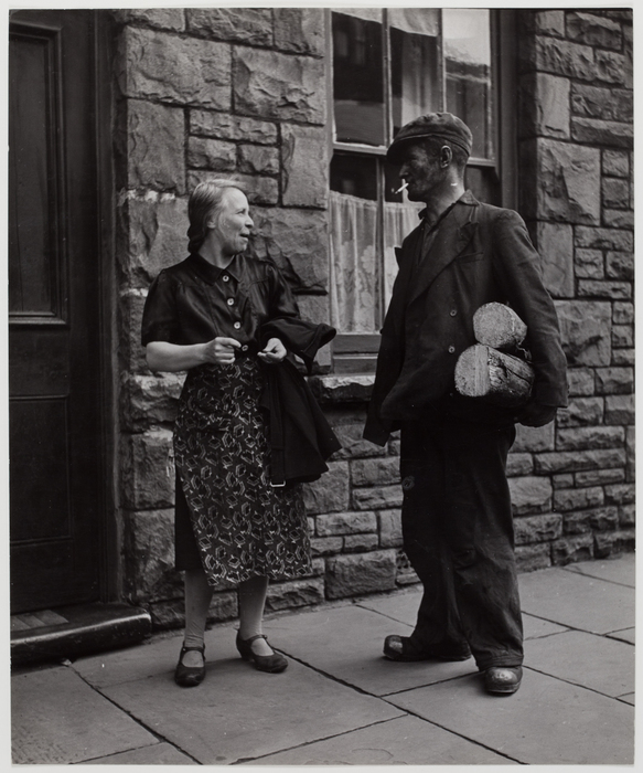 [Woman and coal miner on the street, Rhonnda Valley, Wales]