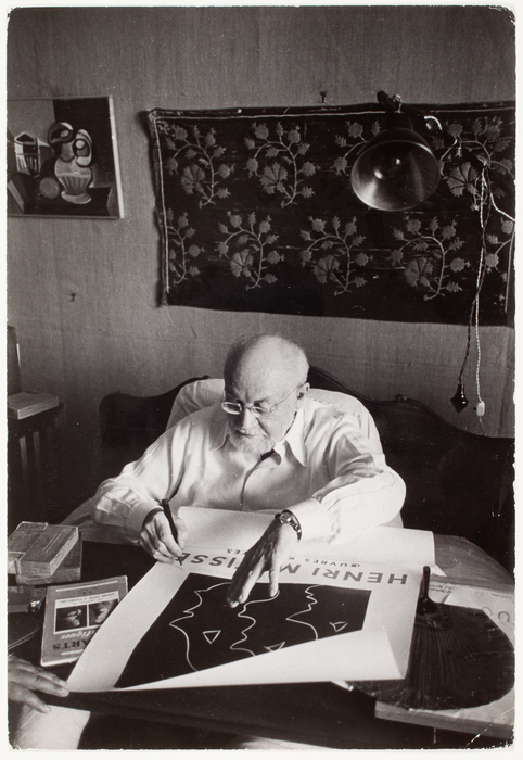 [Henri Matisse signing a poster from his bed at the Hotel Regina in Cimiez, Nice, France]
