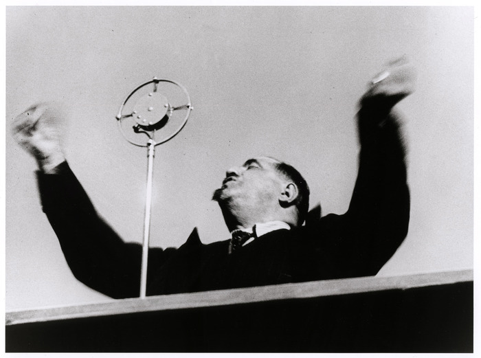 [Labor leader Léon Jouhaux, head of the Confédération Générale du Travail, addressing a rally in the Bois de Vincennes, Paris]