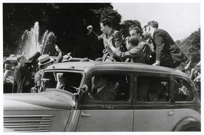 [Group in car celebrating the Popular Front victory in the recent national elections, Paris]