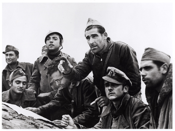 [Officers and commissars of the Marineros battalion look at the heights they must take, Rio Segre, Aragón front, near Fraga, Spain]