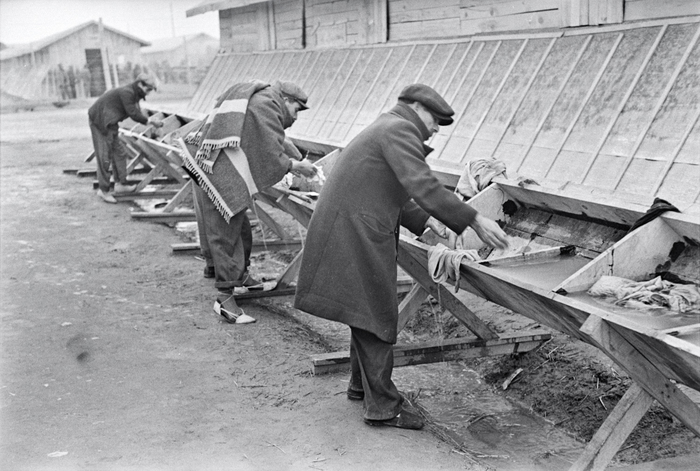 [Men washing at a trough inside an internment camp for Spanish refugees, Le Barcarès, France]