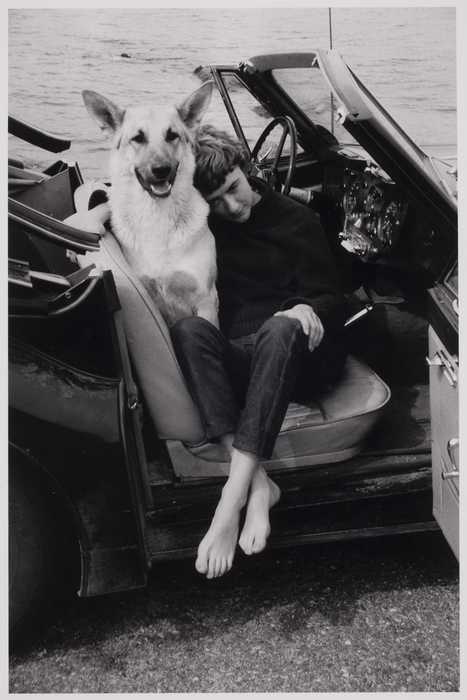 [Writer Françoise Sagan and her dog in a car, St Tropez, France]