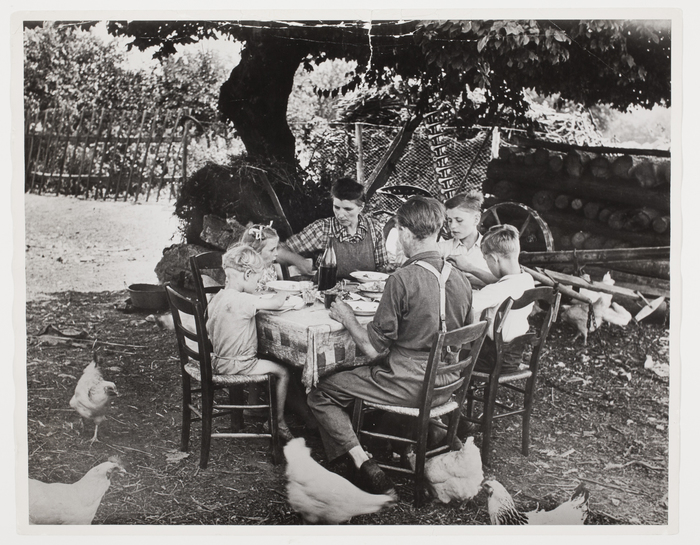 [Family having lunch in the country, France]