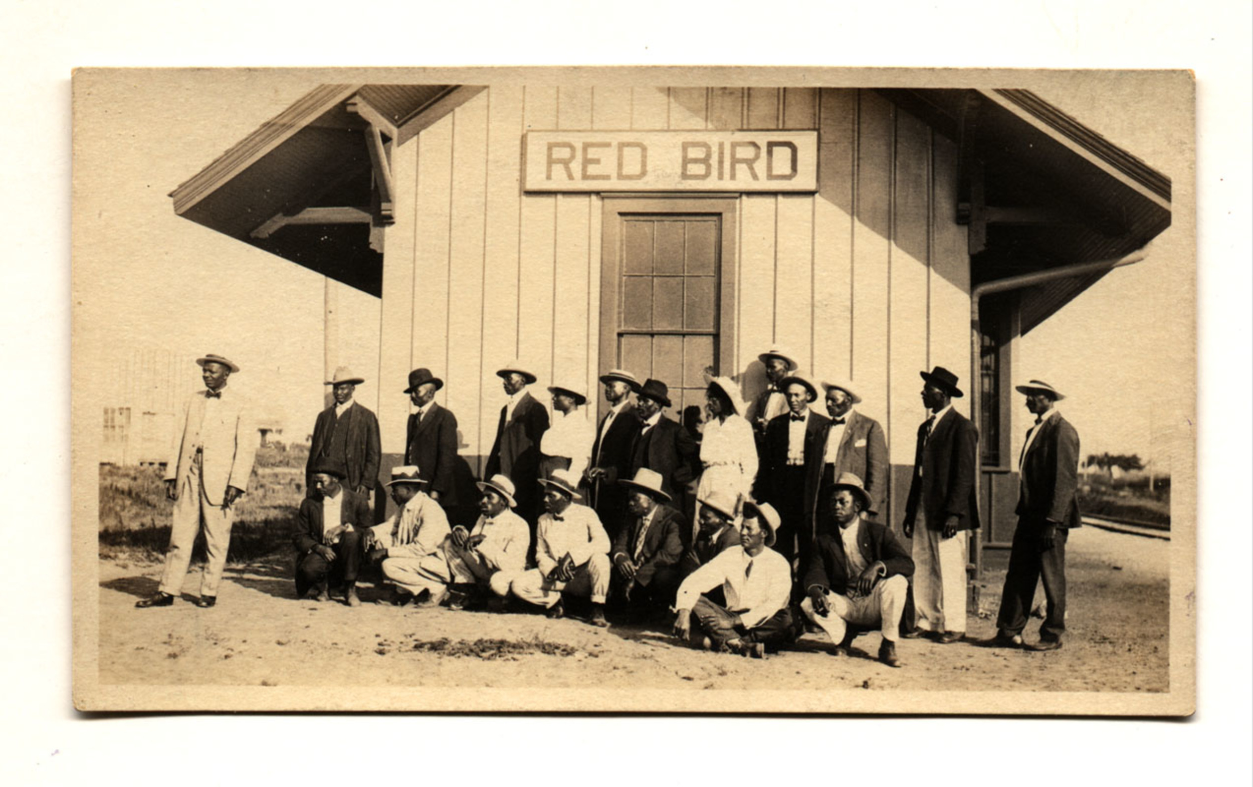[Townspeople of Red Bird, Oklahoma, in front of railroad depot