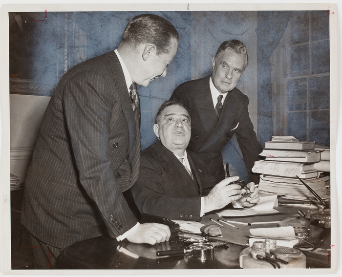 [Mayor Fiorello La Guardia signing a contract with ABC while Mark Woods, ABC President, and Edward J. Noble, ABC board chairman, look on, New York]