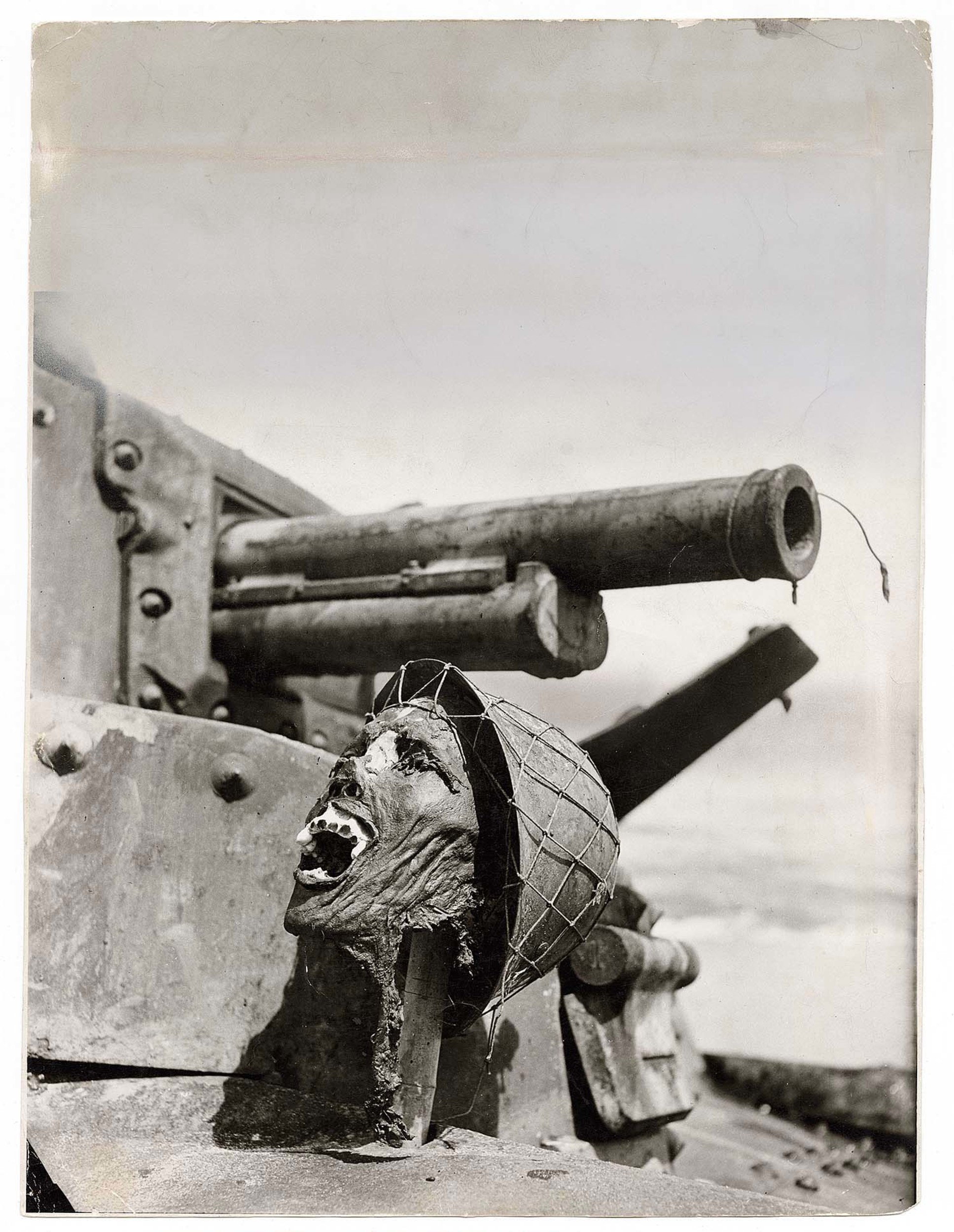 A Japanese soldier's skull is propped up on a burnedout Jap tank by U