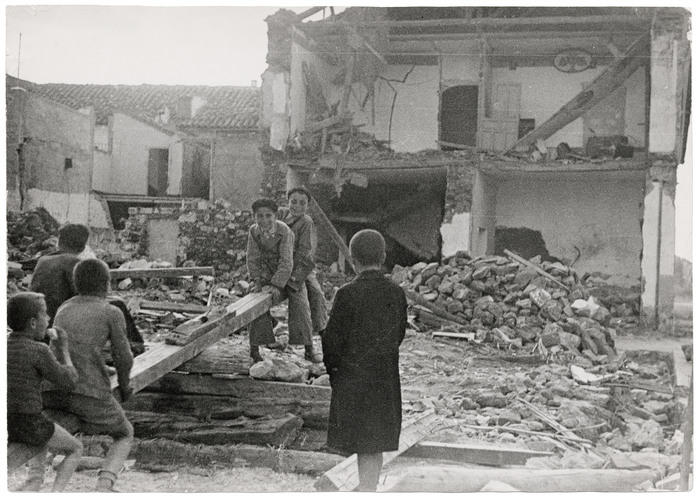 [Children amid rubble of bombed buildings, La Granjuela, Cordoba front, Spain]