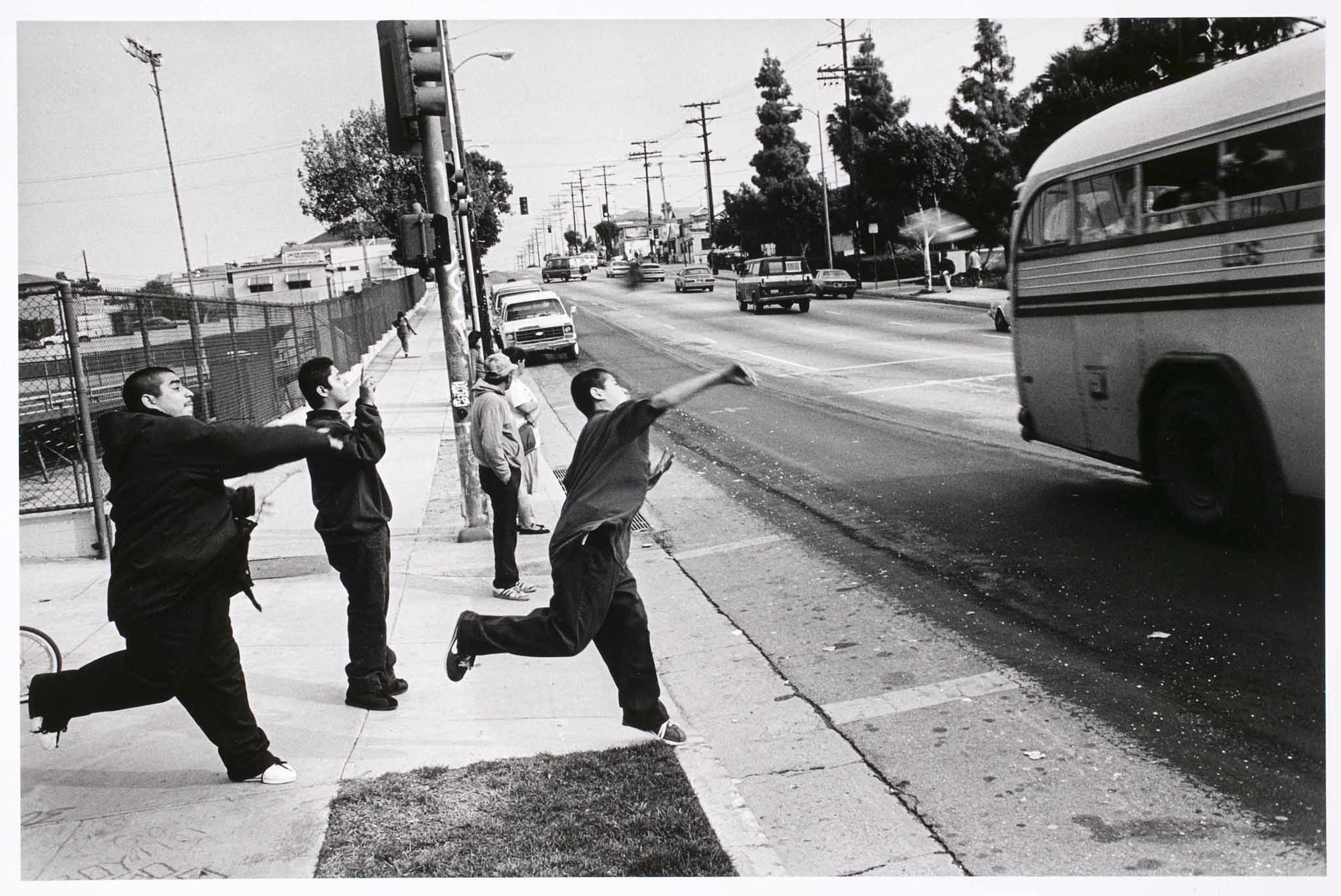 Evergreen members throw bottles at a rival gang. Boyle Heights