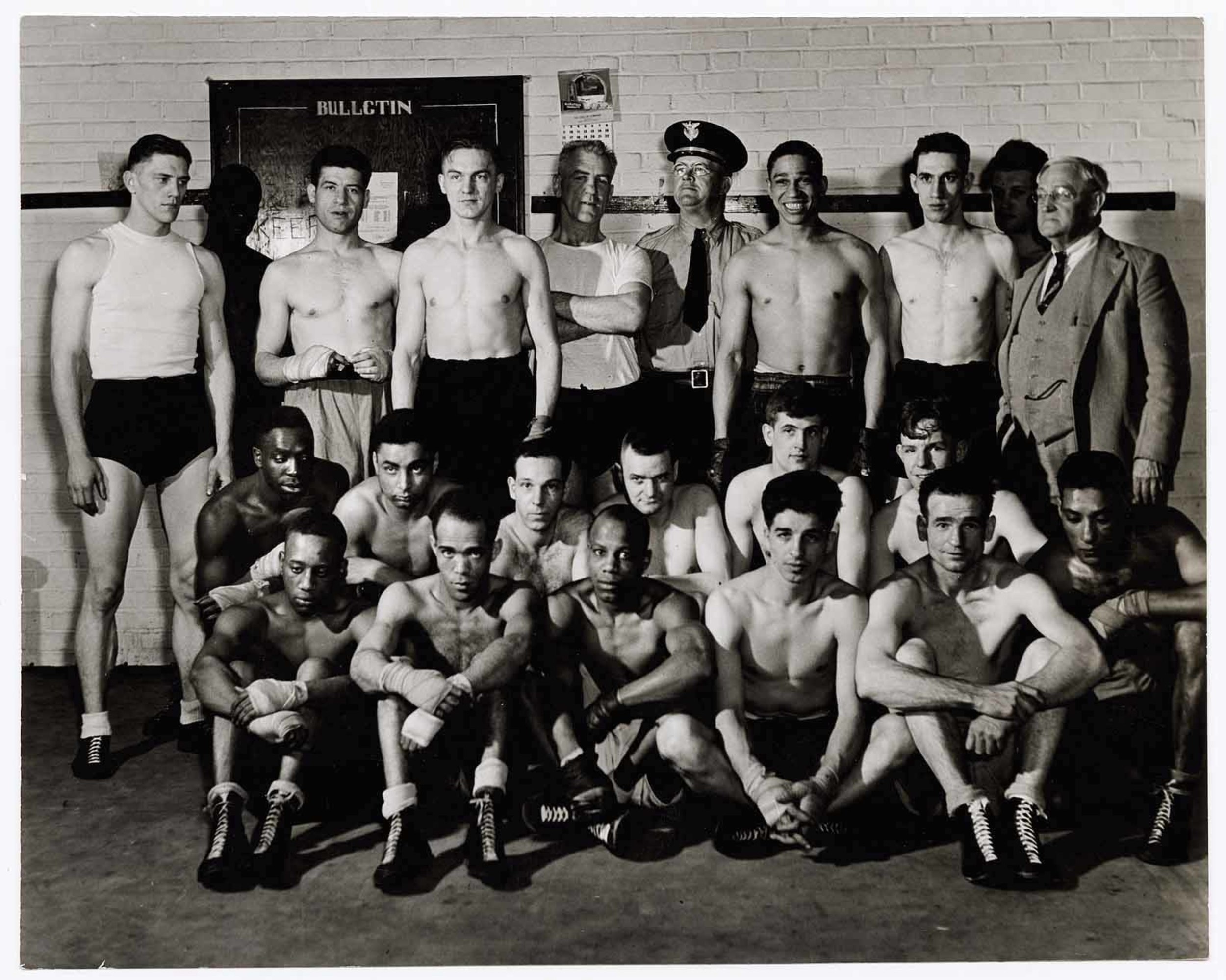 [Boxing class at Ohio Penitentiary. Instructor Pat Bolder (standing directly under calendar
