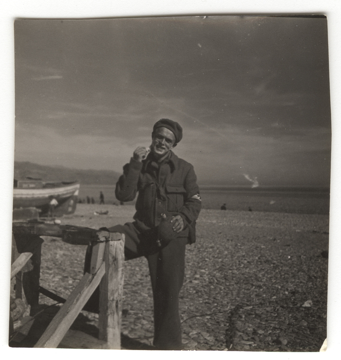 [Sailor shaving on beach, Battleship Jaime I, Almería, Spain]