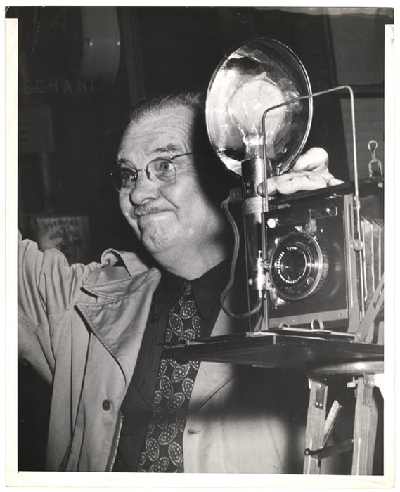 Press photographer with camera