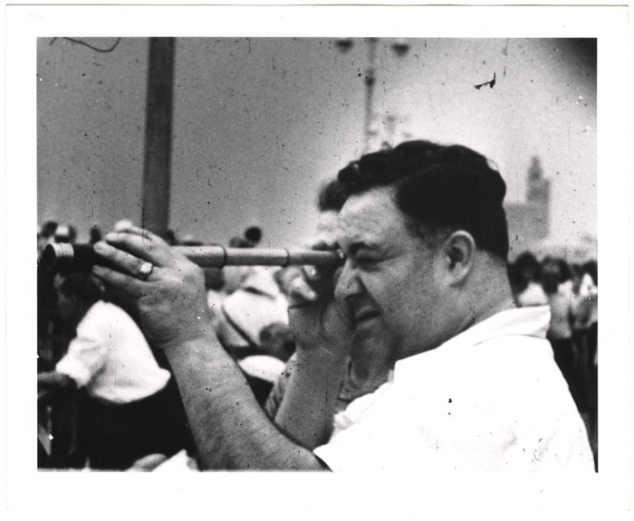 Man looking through telescope