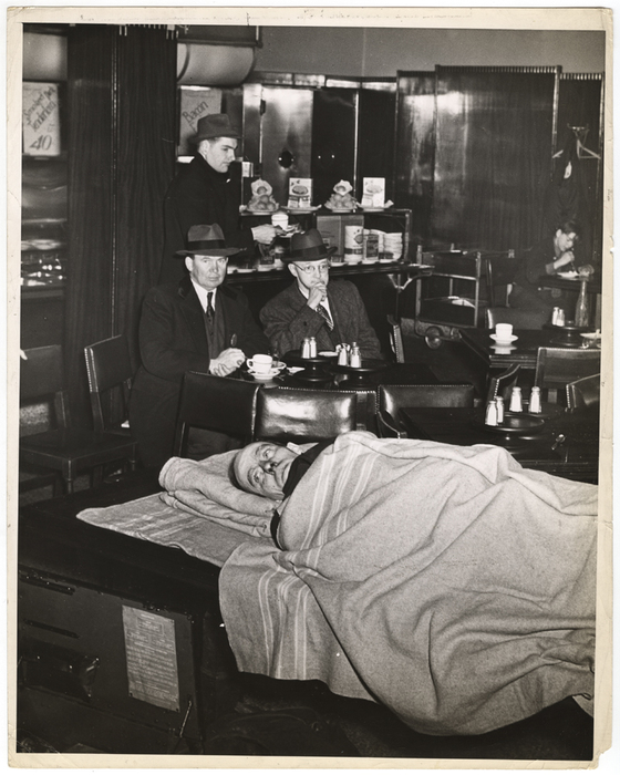 The patrons of the Tip Top Coffee Shop, at 200 Church St., are typical New Yorkers in that they showed no surprise at all when a fireman was brought in on a stretcher, after being treated for smoke poisoning...