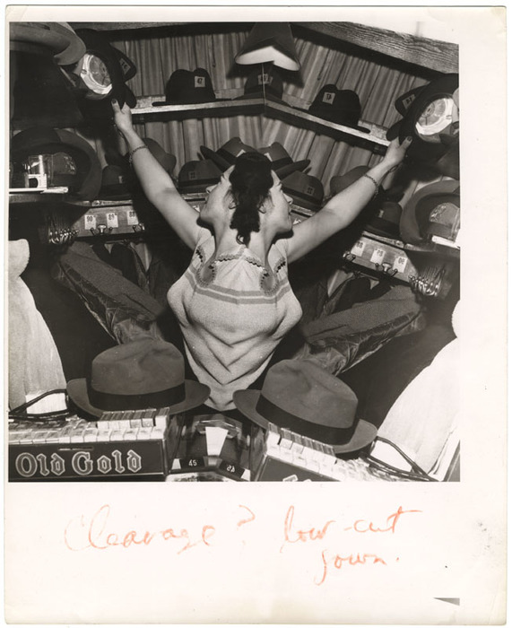 Woman in coat and hat check room (distortion)