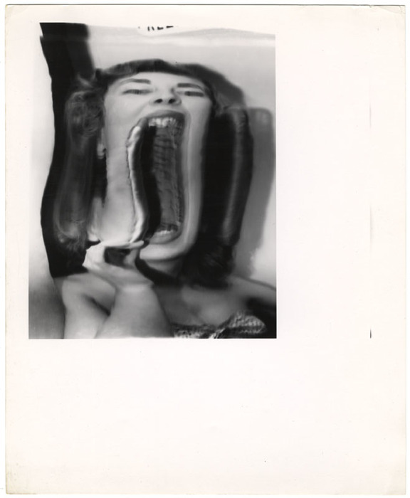 Woman putting on lipstick (distortion)