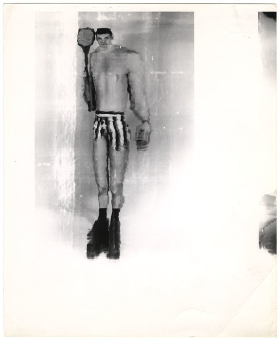 Man posing with tennis raquet (distortion)