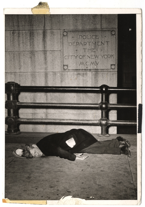 [Derelict sleeping on sidewalk outside police headquarters, New York]