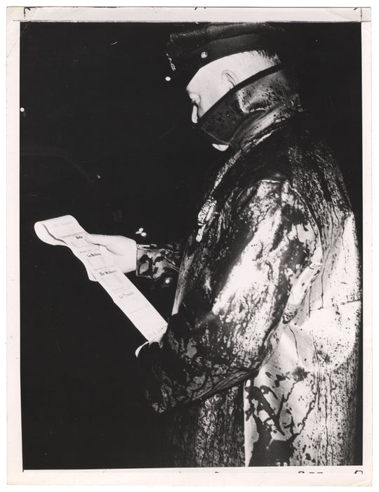 "A [cop] passing by picked up a program from the sidewalk"