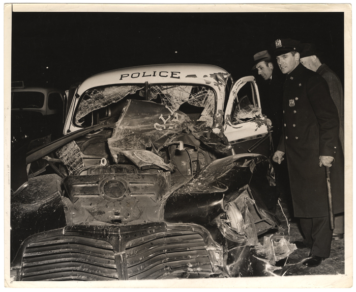 [Police car wrecked in chase after robbers, New York]