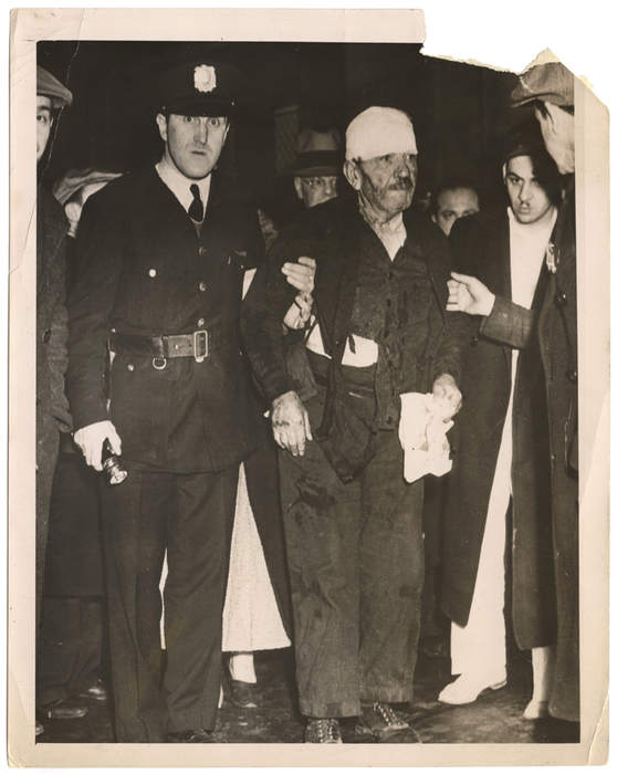 [injured man and police officer]