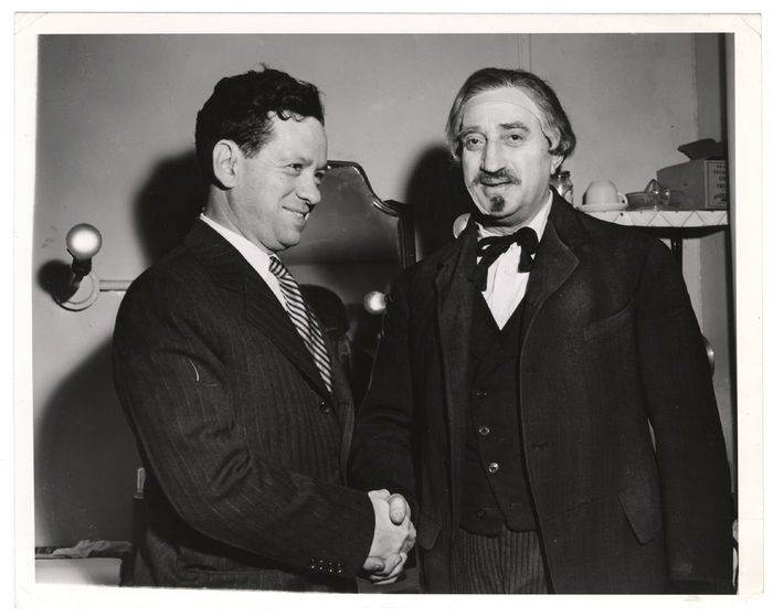 [Yiddish Art Theatre director Maurice Schwartz backstage shaking man's hand, New York]