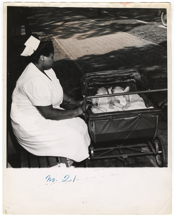 [Woman with babies in a park]