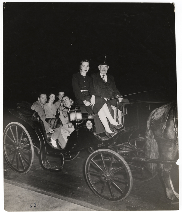 [people on horse drawn carriage]