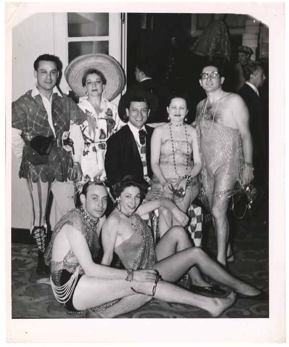 [People wearing costumes at a masquerade ball]