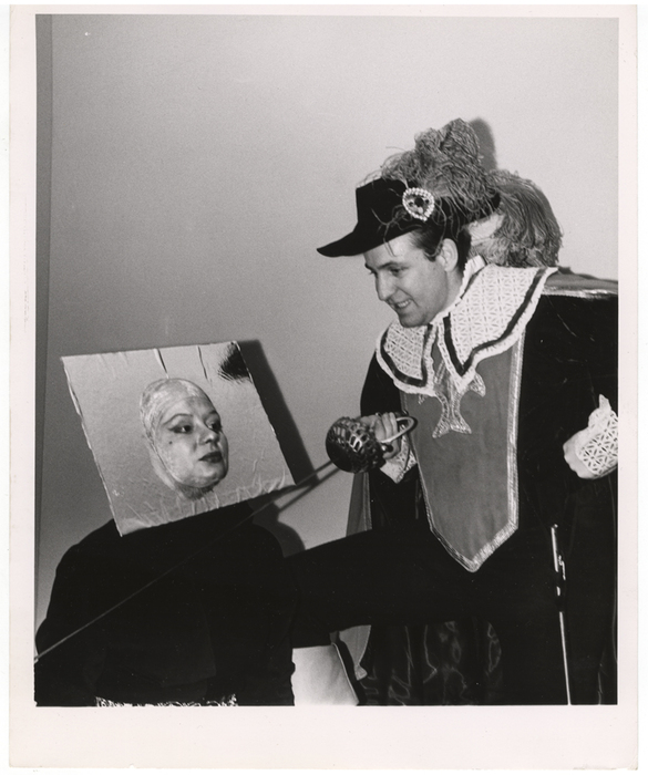 [People wearing costumes at a masquerade ball]