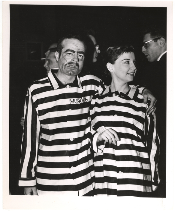 [People wearing costumes at a masquerade ball]